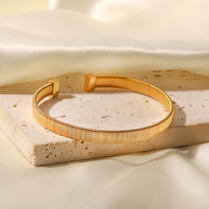 Why It'll Win Your Heart

Value: $48
Size: 6.8 cm
Product Type: Bracelet
About the Product: 18K Gold Plated Plated Stainless Steel Bangle

Product Benefits

Waterproof, Fade-Proof Radiance, Hypoallergenic T Bracelet, Jewelry Girlfriend, Open Bracelet, Open Bangle Bracelet, Wedding Bride Jewelry, Prom Accessories, Detailed Jewelry, Stainless Steel Bangles, Open Bangle