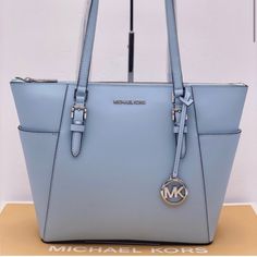 Nwt Michael Kors Charlotte Large Tote Color: Vista Blue Top Zip Tote Silver -Tone Hardware Saffiano Leather Exterior: 2 Slip Pockets Interior: 1 Zip Pocket, 2 Slip Pockets Approx. 11"Bottom-15" Top L:10" H4.5"D Handles Approx. 9.5" Included: If Purchased Over $250 Only ! 1-Huge Mk Shopping Bag 1-Mk Signature Dust Bag Mk Shopping Shopping Bag/Dust Bags Are Sold Separately In The Closet Per Item Bag Luxury Light Blue Bags With Silver-tone Hardware, Elegant Blue Bag With Silver-tone Hardware, Elegant Blue Bags With Silver-tone Hardware, Elegant Light Blue Bags With Silver-tone Hardware, Light Blue Bags With Silver-tone Hardware, Michael Kors Bag Brown, Large Leather Tote Bag, Michael Kors Tote Bags, Black Leather Tote Bag