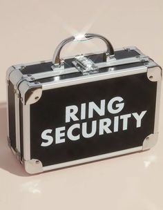 a metal briefcase with the word ring security on it's side and a handle