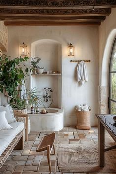 a living room filled with furniture and a large window next to a bathtub covered in plants