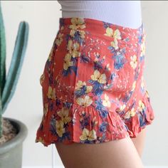 Hibiscus Floral Shorts By Cotton Candy La. Floral Print. Elastic Back. Ruffle Trim. Lining Slip. Sizes Available: 2 Smalls, 1 Medium In Coral Pink New With Tags Length: S- 12" M- 12.25" Waist Across Before Stretch: S- 12.5" M- 13.75" Inseam: 2.5" All Sizes 100% Rayon Boutique Spring Summer Fall Birthday Party Celebration Honeymoon Anniversary Shower Casual Weekend Travel Vacation Beach Dinner Date Night Work School City Fashion Hawaiian Summer Bottoms Short Length, Hawaiian Style Summer Shorts, Hawaiian Style Summer Bottoms In Short Length, Fitted Tropical Style Shorts, Hawaiian Style Short Bottoms With Tropical Print, Fitted Hawaiian Style Bottoms For Vacation, Tropical Fitted Short Bottoms, Tropical Style Summer Shorts, Floral Print High-waisted Shorts For Beach