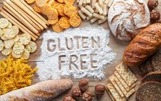 the word gluten free surrounded by bread, crackers and other food items