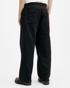 We love sweatpants – we've just made them wider. Comfort looks even better now. These are the Chester Sweatpants. Crafted from organic cotton to a wide-leg fit with an elastic drawcord waist. Completed with four pockets and distinctive stitchwork throughout, these are your new go-to for off-duty dressing.   These sweatpants are designed to a wide-leg fit Pull on Mid-rise Two side pockets Twin needle stitching Fake fly stitch Two back pockets AllSaints branded metal rivets Regular length leg Going Out Outfits Men, Fly Stitch, Wide Leg Sweatpants, Polo Jeans, Knitwear Men, Going Out Outfits, Sweaters And Jeans, Denim Outfit, Chester