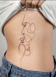 a woman's back with a line drawing on the side of her lower body