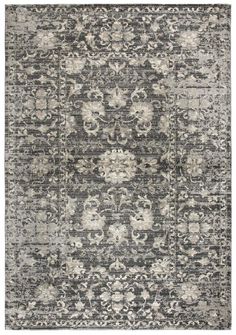 an area rug with black and white designs on the front, in shades of gray