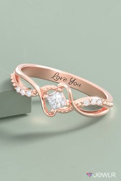 This beautiful birthstone promise ring features a customizable, princess-cut solitaire gemstone and six accent stones. Create yours in silver, yellow, white, or rose gold, and add an engraving for a special touch. This personalized promise ring makes a beautiful birthstone jewelry gift, the perfect girlfriend gift, or a romantic gift for her. #Jewlr #PromiseRing #PersonalizedJewelry #BirthstoneRing #RoseGold #Rings Promis Ring, Solitaire Princess Cut, Personalized Promise Rings, Perfect Girlfriend, Whimsical Ring, Cute Promise Rings, The Perfect Girlfriend, Birthstone Promise Rings, Princess Cut Ring