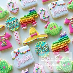 some decorated cookies are sitting on a table