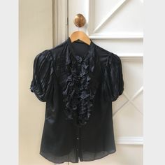 Authentic Vintage Alexander Mcqueen Shirt. Circa 2007 Worn Only A Few Times. In Excellent Used Condition Size 42 Designer Short Sleeve Formal Tops, Luxury Fitted Ruffle Tops, Black Formal Shirt With Ruffles, Formal Black Shirt With Ruffles, Black Ruffled Shirt For Formal Occasions, Black Silk Top With Ruffles, Black Silk Ruffled Top, Luxury Black Shirt For Spring, Black Silk Short Sleeve Top