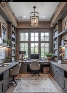 a home office with built in desks and shelves