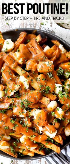 a skillet filled with potatoes covered in gravy and garnished with parsley