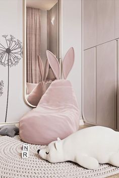 a white stuffed animal laying on top of a rug next to a mirror and door