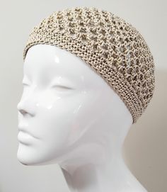 Inspired by the boho chic and disco styles of the 1970's, this pale gold crochet skull cap will put you in the party mood. If you're planning a night out with the girls or going off to a festival, this hat adds a stylish finishing touch to your outfit. Hand crafted with high quality, fine 100% mercerised cotton yarn, this pale gold sparkle skull cap also has a metallic gold thread working throughout the design for extra sparkle.   You can wear this crochet hat as a classic beanie, or to the side Beige Crochet Cap One Size Fits Most, One Size Fits Most Beige Crochet Cap, Adjustable Crochet Party Hat, Adjustable Lightweight Crochet Beanie Hat, Adjustable Lightweight Crochet Beanie, Lightweight Adjustable Crochet Beanie Hat, Adjustable Lightweight Cream Crochet Hat, Adjustable Cream Crochet Cap, Cream Bohemian Crochet Hat With Adjustable Fit