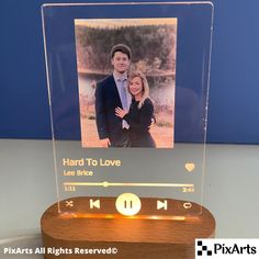 a clear acrylic plaque with an image of a man and woman on it