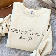 Dachshund Shirt Dog Personalized shirt Dachshund Personalized Sweatshirt Dachshund Mom Sweatshirt dachshund mom shirt dachshund sweatshirt This soft unisex tee brings a new take on everyday comfort. Made from super soft material, this T-shirt is made from 100% cotton in solid colors.  --Shoulders are trimmed with twill tape for added durability. There are no side seams. The collar is ribbed to prevent damage from twisting. --Sweatshirt feels cozy and is the perfect choice for those colder months Long Sleeve Cotton T-shirt With Dog Print, Cotton Long Sleeve T-shirt With Dog Print, Casual Long Sleeve T-shirt With Dog Print, Long Sleeve Cotton Sweatshirt With Dog Print, Dachshund Shirt, Dachshund Mom, Mama Shirts, Mama Sweatshirt, Mom Sweatshirt