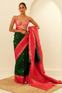 Bottle green silk kanjeevaram saree featuring zari woven floral and peacock motifs, highlighted by contrast coral border. Comes with unstitched blouse fabric. - Aza Fashions Transitional Green Pre-draped Saree With Self Design, Green Raw Silk Pre-draped Saree With Self Design, Green Cotton Silk Choli With Traditional Drape, Designer Green Katan Silk Pre-draped Saree, Fitted Green Tussar Silk Blouse Piece, Elegant Green Cotton Silk Saree, Green Art Silk Choli With Handloom Detail, Green Handloom Choli For Festivals, Green Handloom Choli For Navratri