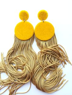 Elegant handmade earrings, golden yellow velvet earrings with golden high quality fringe. Stainless steel clasp on the back of the earring. Lenght: 14cm width: 3cm The earring color plays in the sun and changes from light to dark tones, which makes them one of a kind. If You are looking for large but lightweight earrings, then this is the right choice. The material used for the earring is surgical steel wich hopefully won't cause any allergies. Earrings come with a gift box. Made with love by No Trendy Gold Tassel Earrings With Fringe, Yellow Fringe Jewelry For Party, Handmade Gold Tassel Earrings For Party, Gold Handmade Tassel Earrings For Party, Yellow Dangle Tassel Earrings For Party, Yellow Tassel Drop Earrings For Party, Elegant Yellow Fringe Earrings, Elegant Yellow Tassel Earrings, Yellow Fringe Tassel Drop Earrings