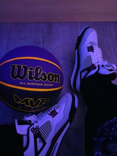 a pair of shoes and a basketball sitting on the floor