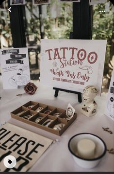 a table topped with lots of different types of tattoos and other items on top of it