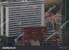 an aerial view of some buildings and skyscrapers in the city center of berlin, germany