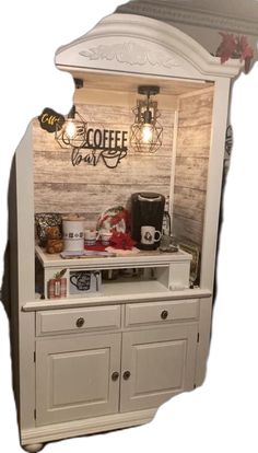 an old fashioned coffee cart with lights on it's top and drawers below the counter