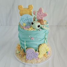 there is a cake decorated with animals and stars