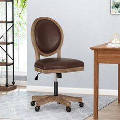 a brown leather office chair sitting on top of a wooden desk next to a book shelf