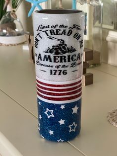 an american flag coffee cup sitting on top of a counter