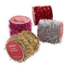 three rolls of tinsel yarn with red and silver tinsel