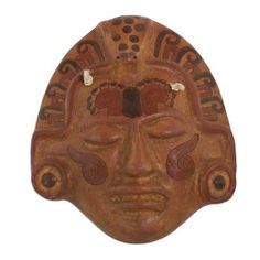 an african mask is shown against a white background