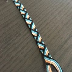 a close up of a blue and white rope on a table