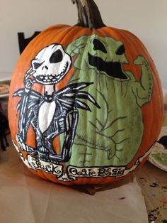 a pumpkin decorated with an image of jack skellingy and the skeleton on it