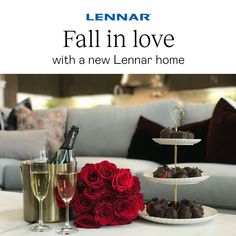 three tiered trays with roses and champagne on a table in a living room