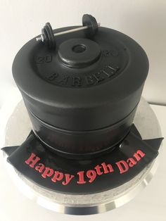 a black cake with red lettering on it