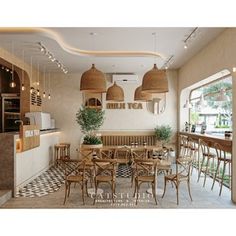 the interior of a restaurant with tables and chairs, potted plants on the counter