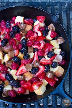 a skillet filled with fruit and chocolate