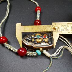 This portable Gau shrine was handcrafted by Tibetan artisans from Hepo Township, Baiyu County. Its theme is mani jewel, a treasure vase on a lotus base, inside the vase are mani jewels and other jewels.Each exquisite pattern on it is meticulously hand-carved,and it is embellished with the technique of gold inlay, with cold iron and pure silver inlaid on the red copper material and gold-plated on the pure silver material,inlaid with turquoise and agate bead. This technique is highly intricate and