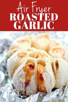 an air fryer roasted garlic on foil with text overlay