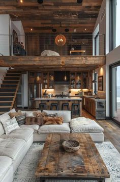 a living room filled with furniture next to a staircase