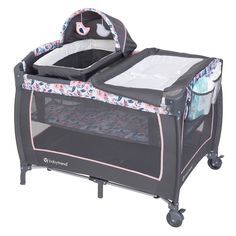 a baby crib with an infant in it