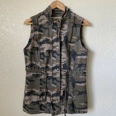 Camouflage Vest 100% Cotton Size Large Approx. Chest 19” Back neck below collar to hem 26” box F Hunting Sleeveless Vest Outerwear, Military Style Outdoor Vest Outerwear, Camo Vest, Military Style Camouflage Tops With Pockets, Slim Vest, Summer Military Camouflage Tops, Military Camouflage Tops With Pockets, Military Jacket, Camouflage