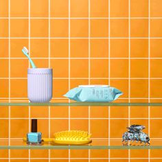 there is a shelf that has various items on it, including a toothbrush and soap dispenser