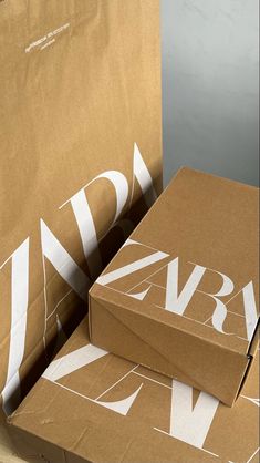 two boxes are stacked on top of each other with the letters v and n printed on them