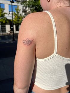 a woman with a heart tattoo on her back