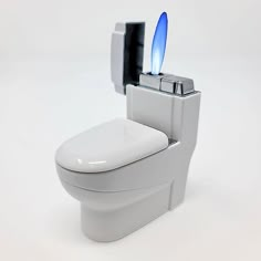 a white toilet with a blue light on it