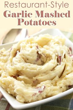 mashed potatoes in a white bowl with text overlay that reads restaurant - style garlic mashed potatoes