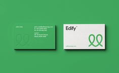 the business card is designed to look like it has an q on it and green letters