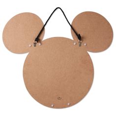 a mickey mouse head with two ears hanging from it's side, on a white background