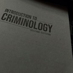 an open book with the words criminology written on it's cover