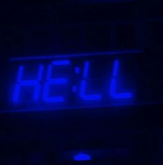 a neon blue sign that says hell on it