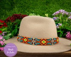 Dress up any hat with this western beaded leather hat band. Beautiful native and Navajo patterns with vibrant colors. Bring a southern charm to your old favorites with this gorgeous hat band or make your new hat even more special. Made of full grain leather (highest grade leather) and glass beads. Handmade in Brazil by artisan women. You can match your hat band with our best-selling leather beaded dog collars! Treated with beeswax, water resistant. 30 days free returns or exchange. 1-year warran Western Turquoise Beaded Hat Bands, Handmade Southwestern Turquoise Hat Bands, Southwestern Turquoise Beaded Hat Bands, Southwestern Beaded Turquoise Hat Bands, Southwestern Adjustable Multicolor Hat Bands, Adjustable Southwestern Multicolor Hat Bands, Adjustable Multicolor Southwestern Hat Bands, Southwestern Multicolor Hat Band For Country Events, Handmade Multicolor Hat Bands For Rodeo